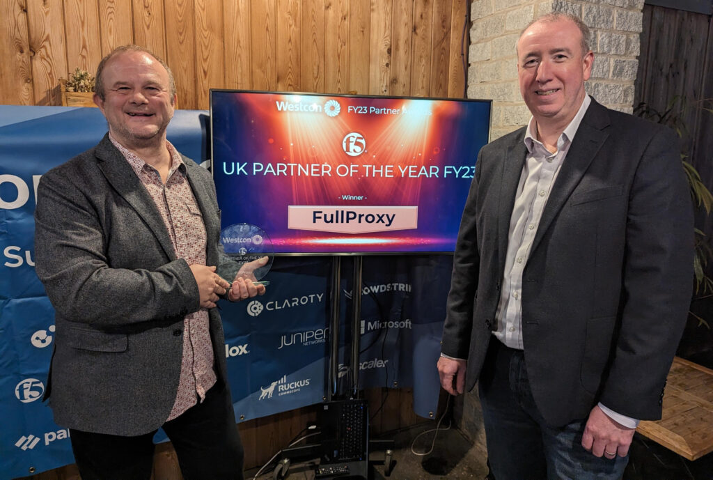 Photo of CEO Ewan and CTO Chris collecting the F5 Gold Partner of year award