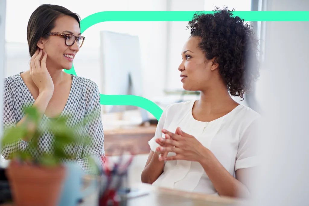 Women talking with green keyline