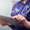 Nurse in uniform with ipad